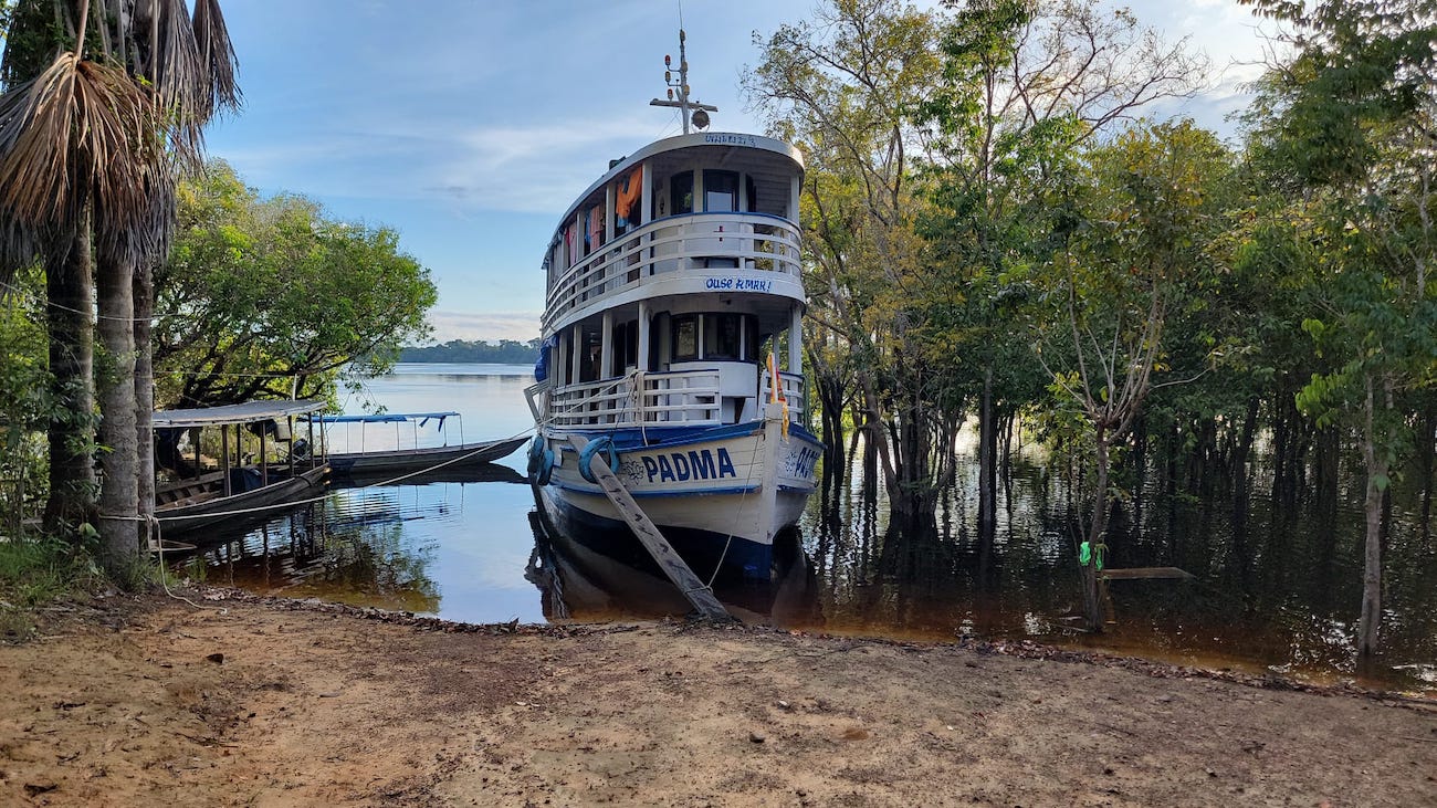 Dr. Daniel Jones treating a patient in a riverside Amazon community
